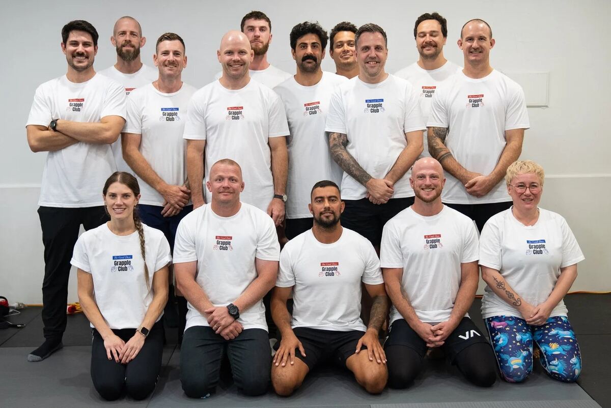 The Good Dose coaching team smiling at the camera